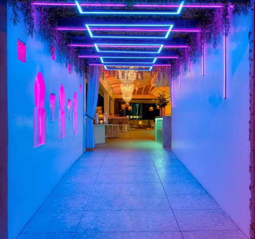 Illuminated late-night entrance at Louie’s